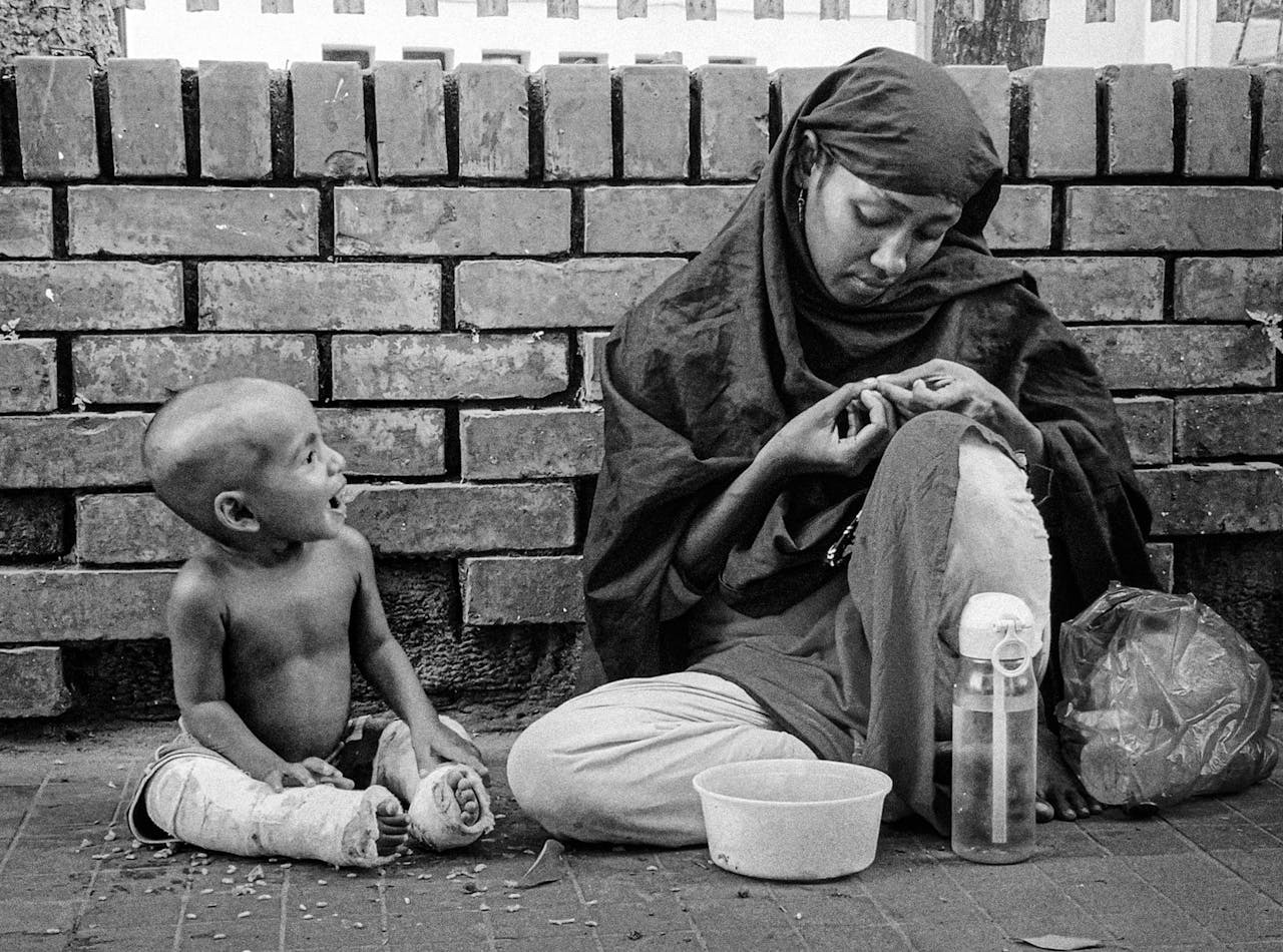 Emotive black and white photo of a mother and child sharing a moment.